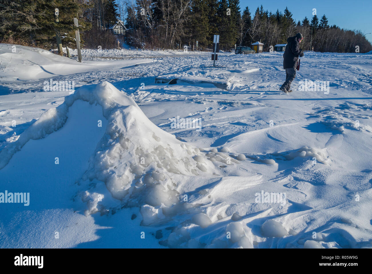 Sculpted ice and snow along the shoreline of Clear Lake in Riding