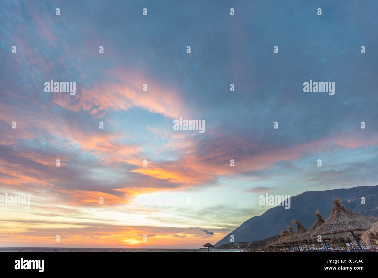 Dramatic colored sky. Moon and star in the clouds. Stock Photo