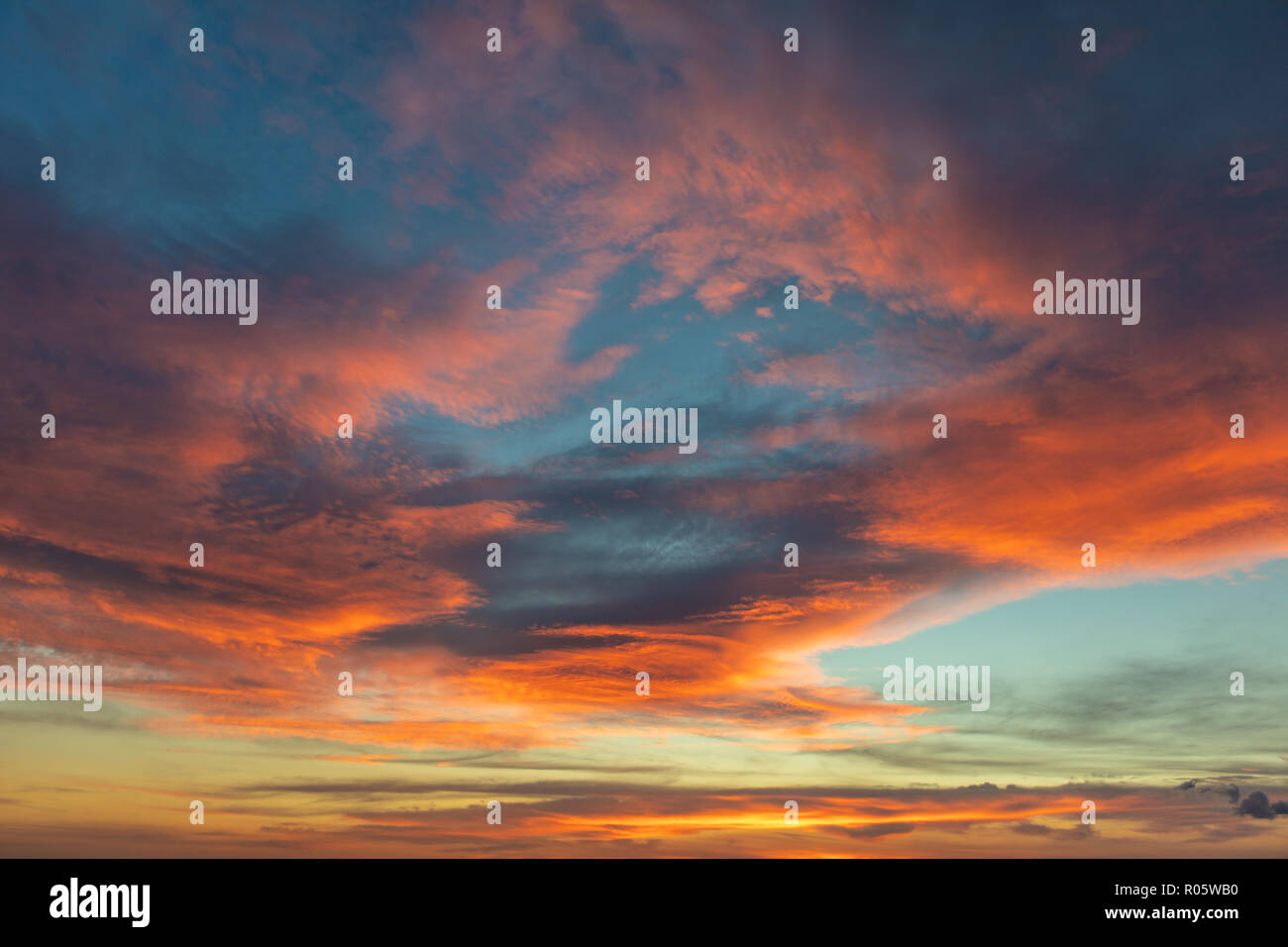 Dramatic colored sky. Moon and star in the clouds. Stock Photo