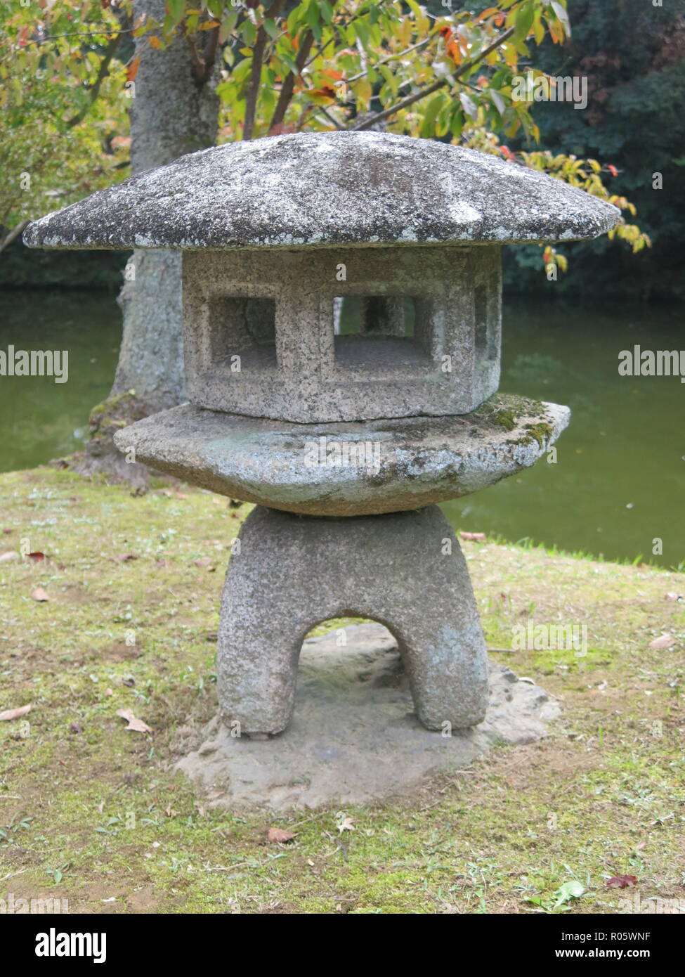 A traditional Japanese stone lantern in a garden in Kyoto, Japan Stock  Photo - Alamy