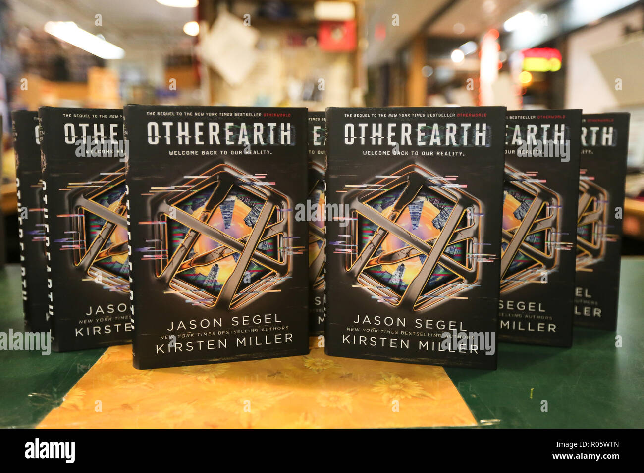 HUNTINGTON, NY - OCT 30: Copies 'OtherEarth - Welcome Back to Reality' by Jason Segel and Kirsten Miller at Book Revue on October 30, 2018. Stock Photo