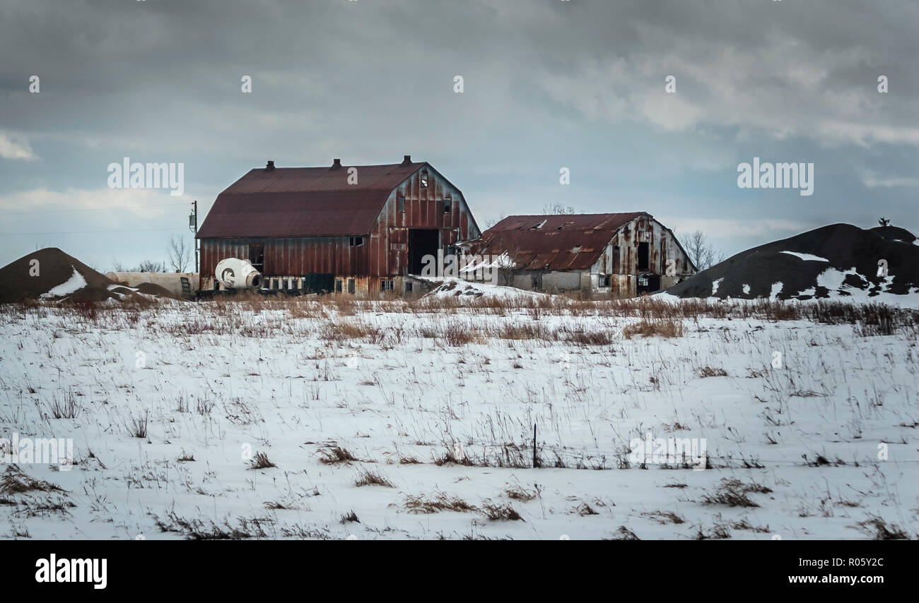 Barns on a farmland during a snowy winter in Ontario, Canada Stock Photo