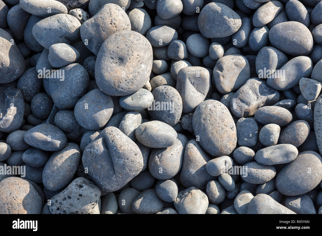 Stones rounded by the sea on the shore, Snaefellsnes Peninsula, Iceland Stock Photo