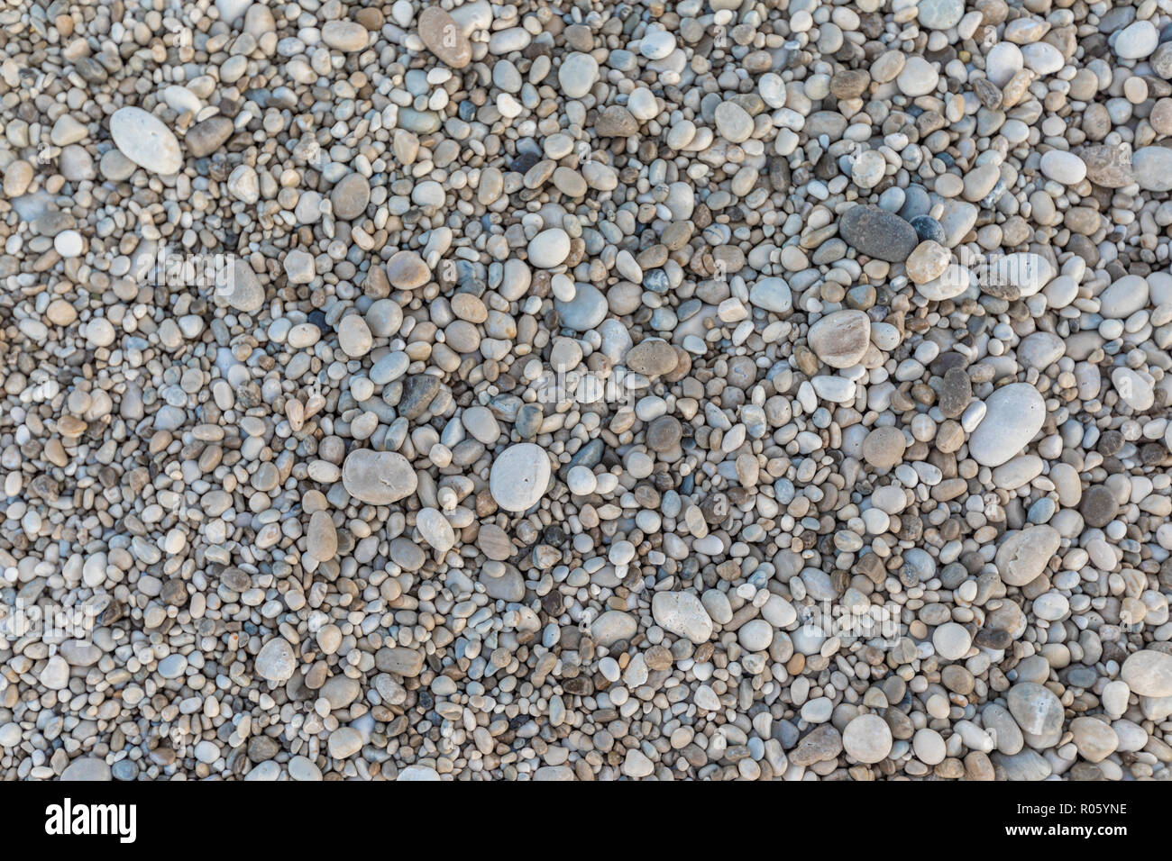 Background with white pebbles on the Albanian beach Stock Photo