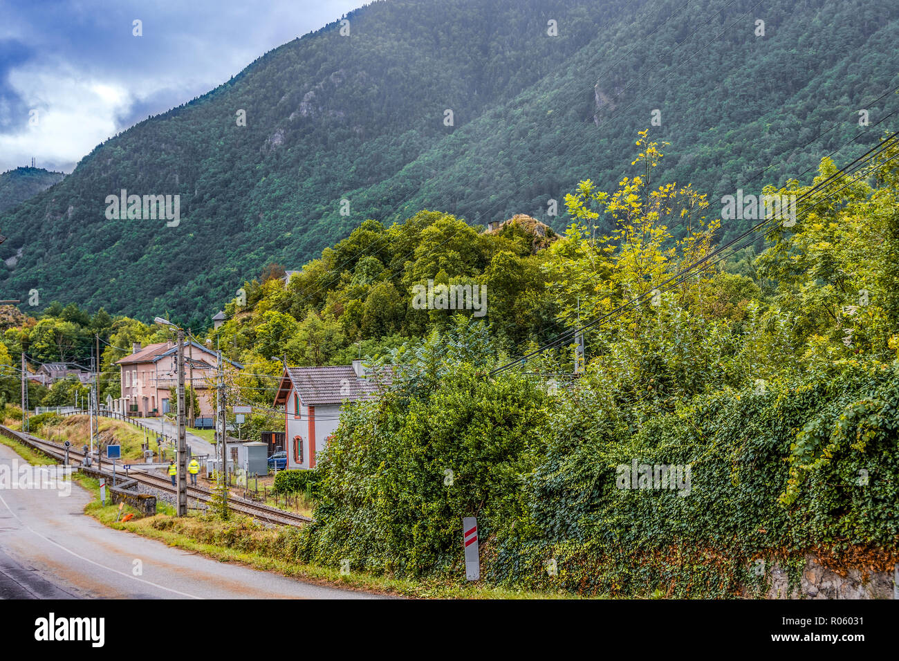 Near the French-Andorran border we see the station of the village of Ax-les-thermes and the old route in the Department of Ariege. France Stock Photo