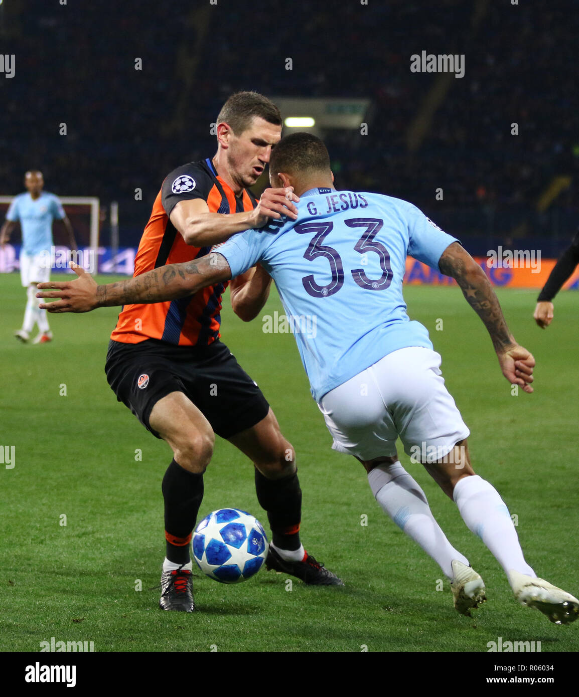 KHARKIV, UKRAINE - OCTOBER 23, 2018: Serhiy Kryvtsov of Shakhtar Donetsk (L) fights for a ball with Gabriel Jesus of Manchester City during their UEFA Stock Photo