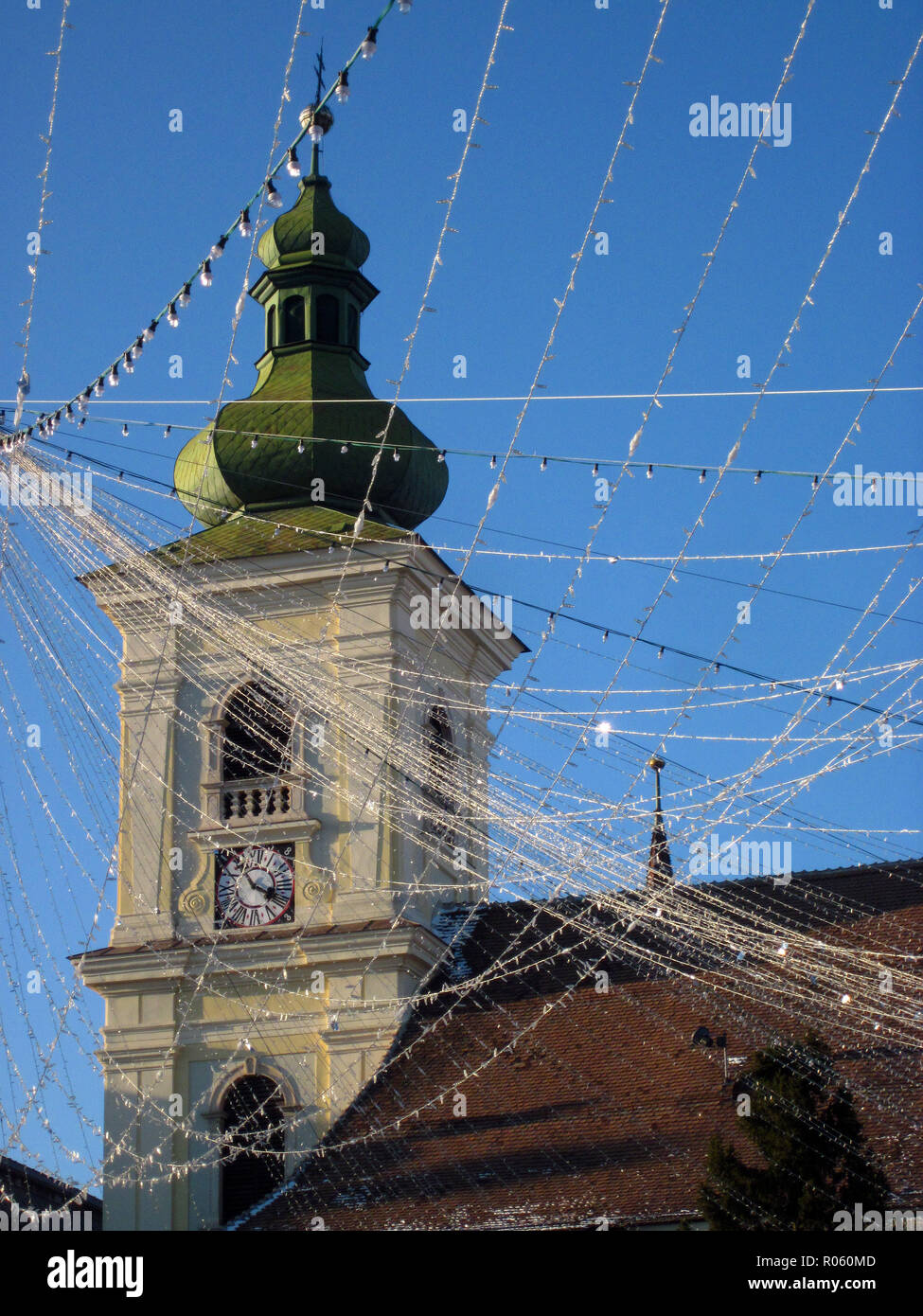 Catholic Church tower, strewn with Christmas lights, Sibiu, Romania Stock Photo