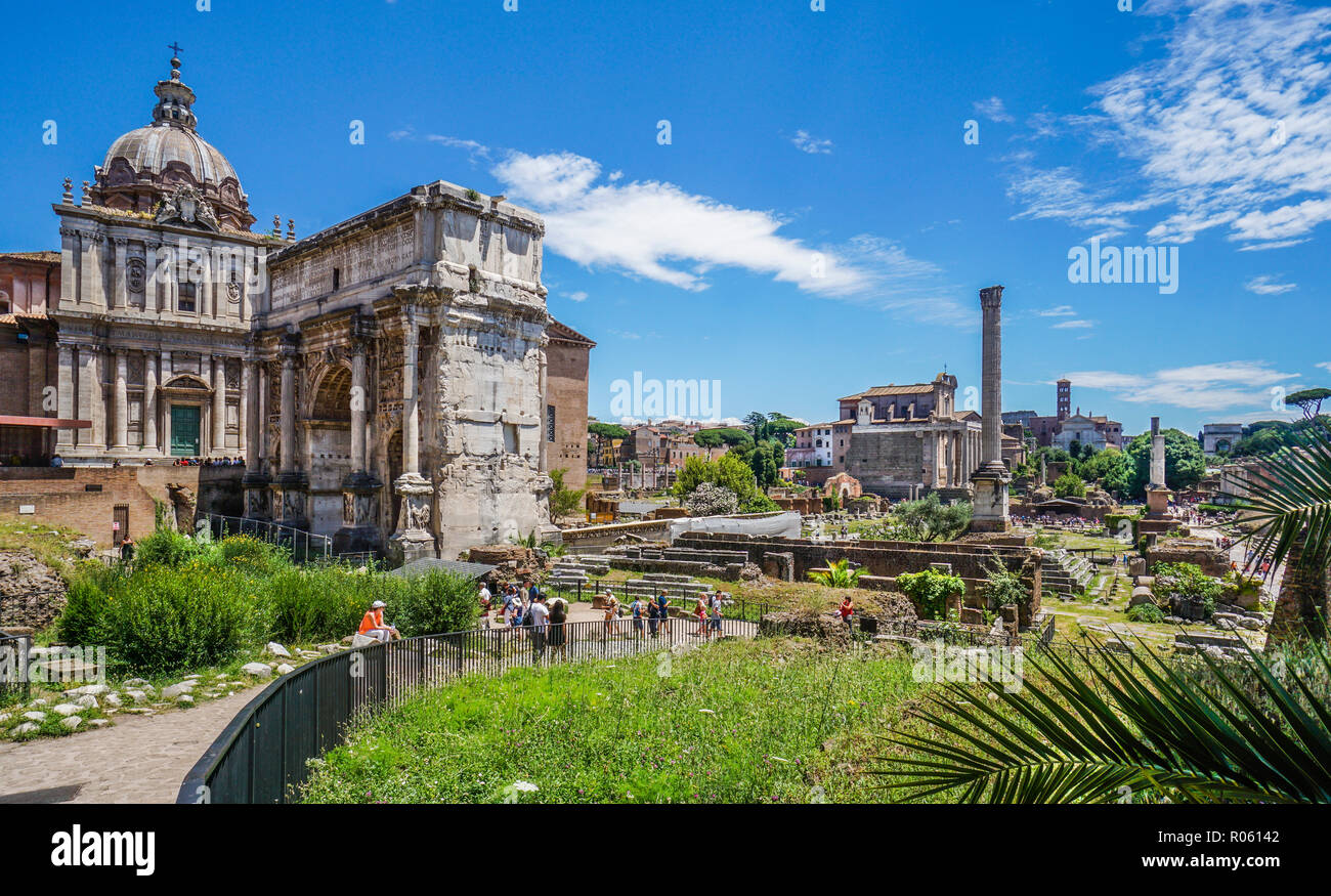 view of the Central Square of the Roman Forum, the ancient city of Rome with the Santi Luca e Martina Church, the triumphal arch of Septimus Severus,  Stock Photo