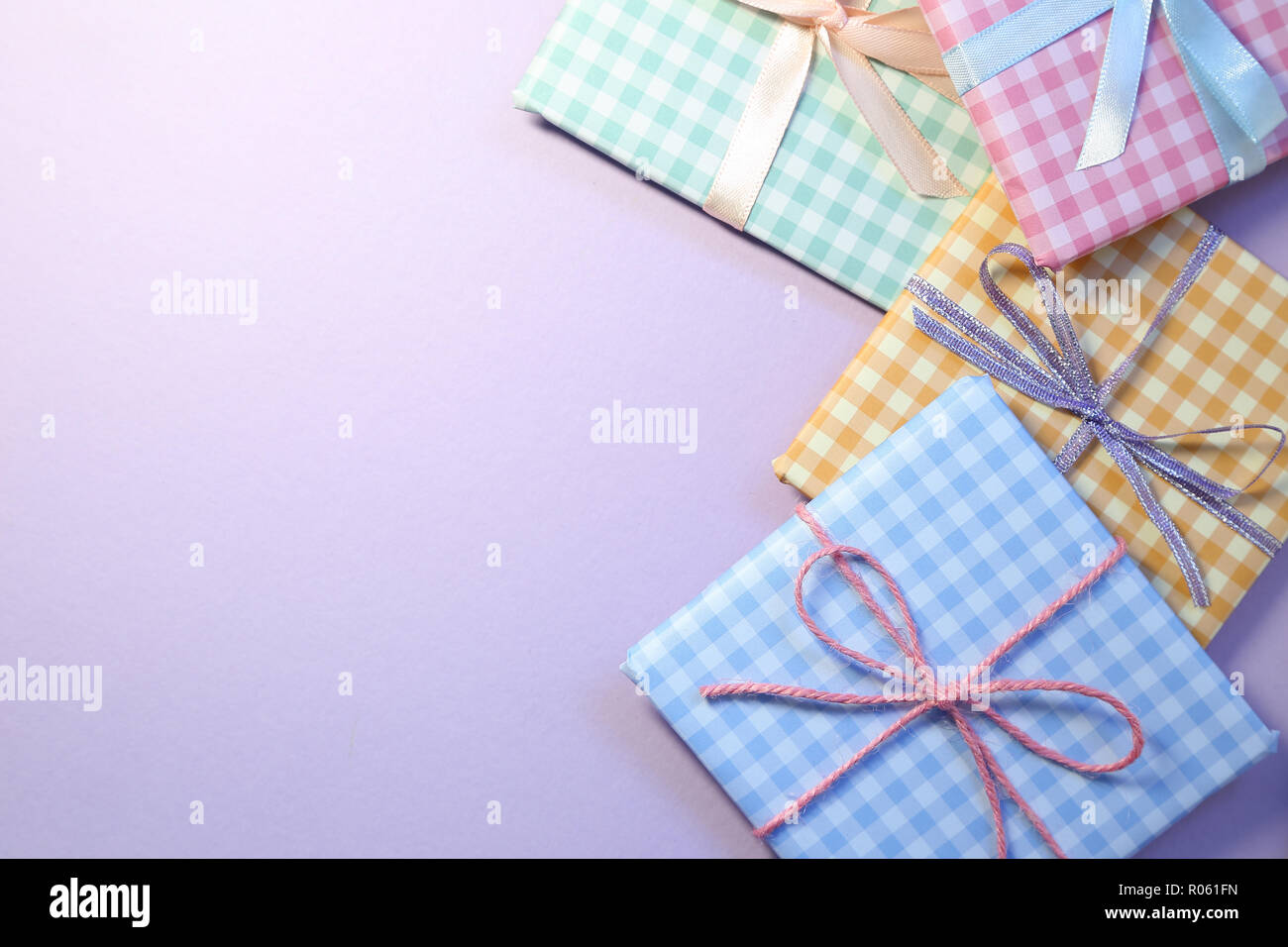 Check pattern colorful gift boxes on purple background Stock Photo