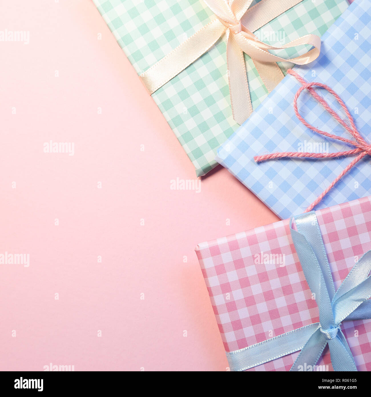 Check pattern colorful gift boxes on pink background Stock Photo