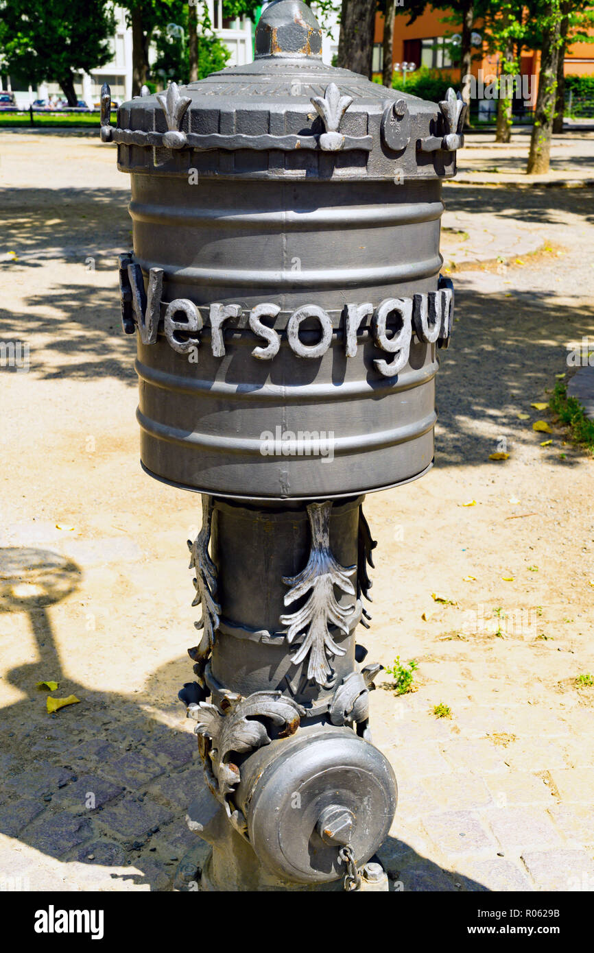 Hydrant in Wiesbaden Germany with lettering Versorgung means Care Stock Photo
