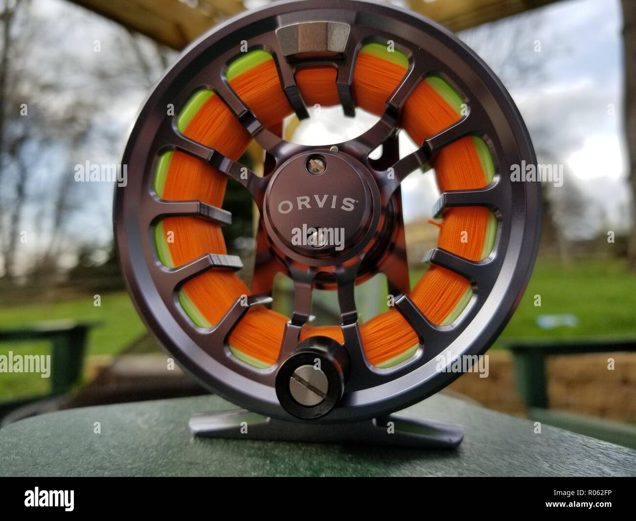 Orvis Recon fly fishing reel sitting ready to be put on a Orvis Recon fly rod Stock Photo