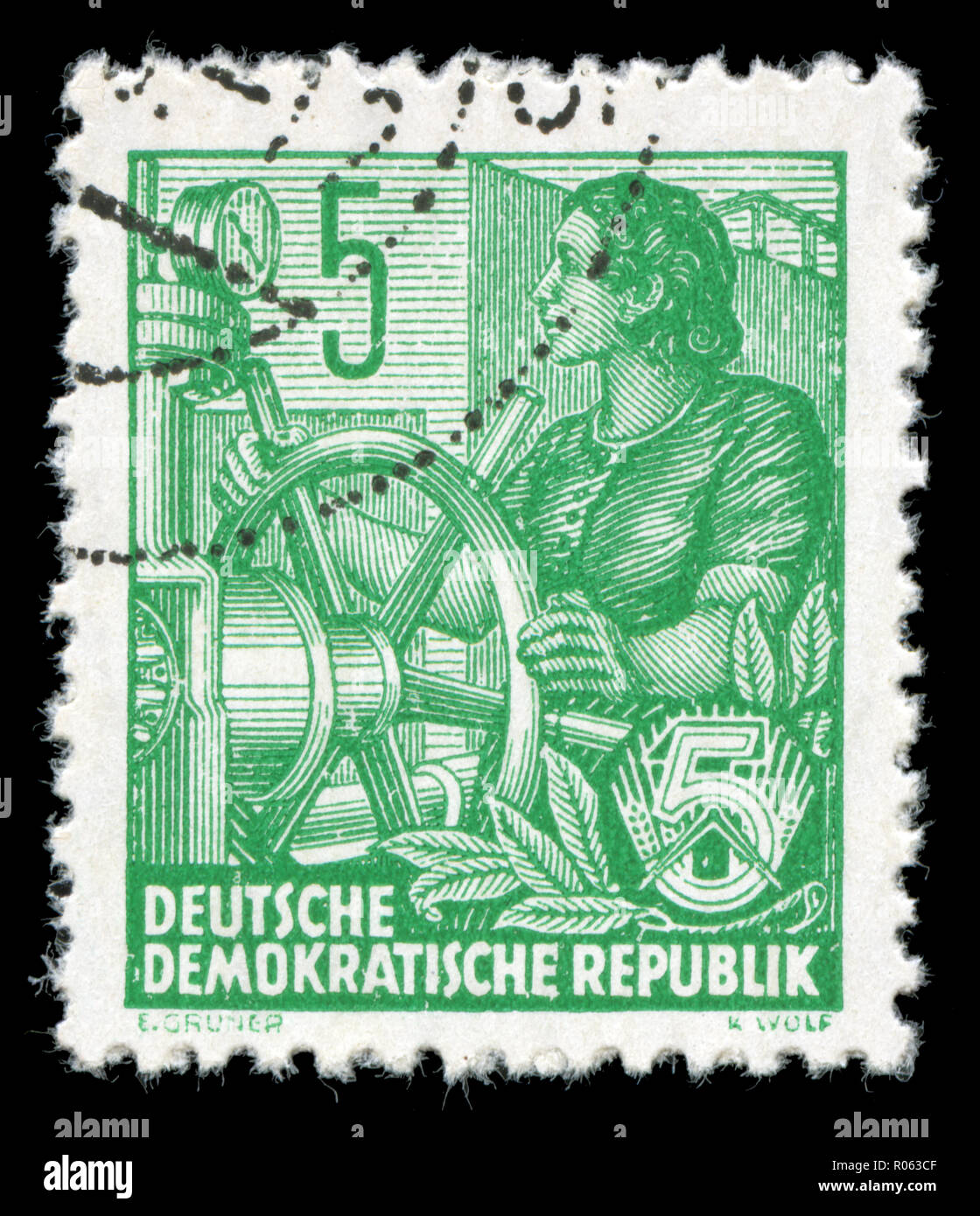 Postmarked stamp from the East Germany in the Five-year Plan series Stock Photo
