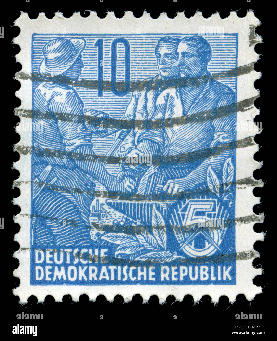 Postmarked stamp from the East Germany in the Five-year Plan series Stock Photo