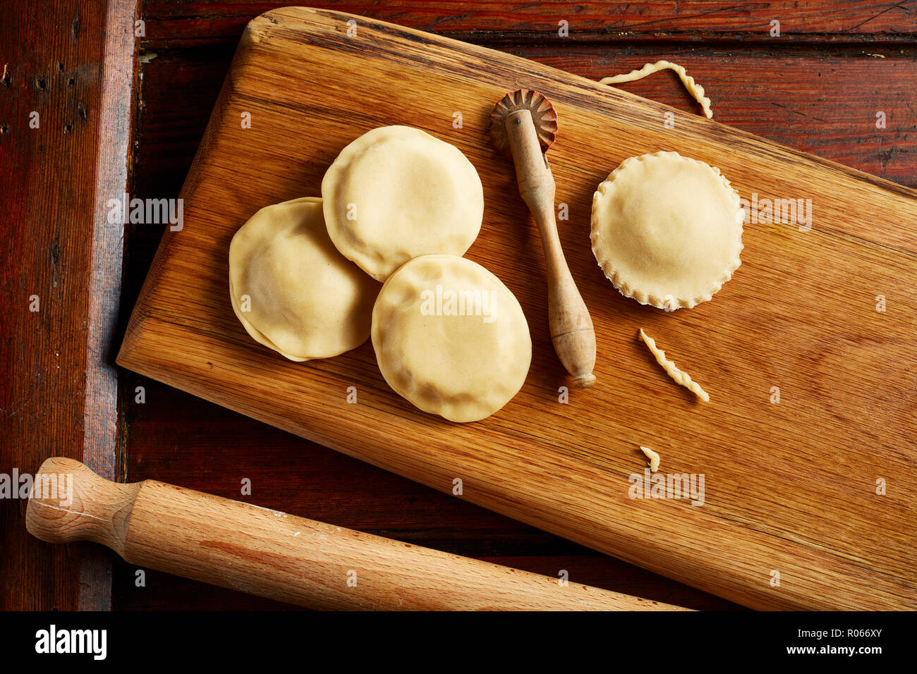Fruit tarts, uncooked on plank Stock Photo