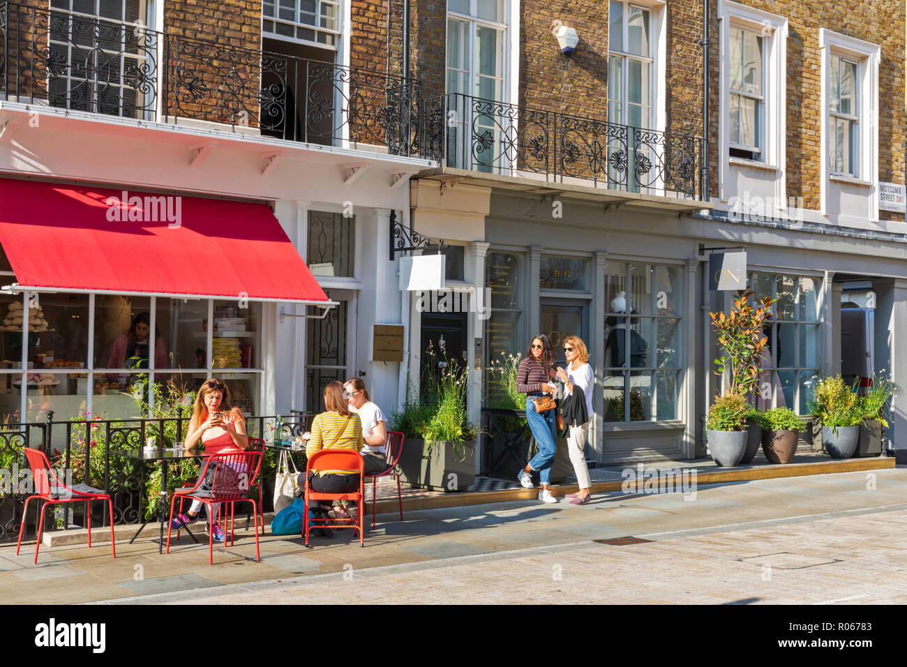 Customers outside the Ottolenghi deli and cafe in Motcomb Street, Belgravia, Knightsbridge, London, England, UK Stock Photo