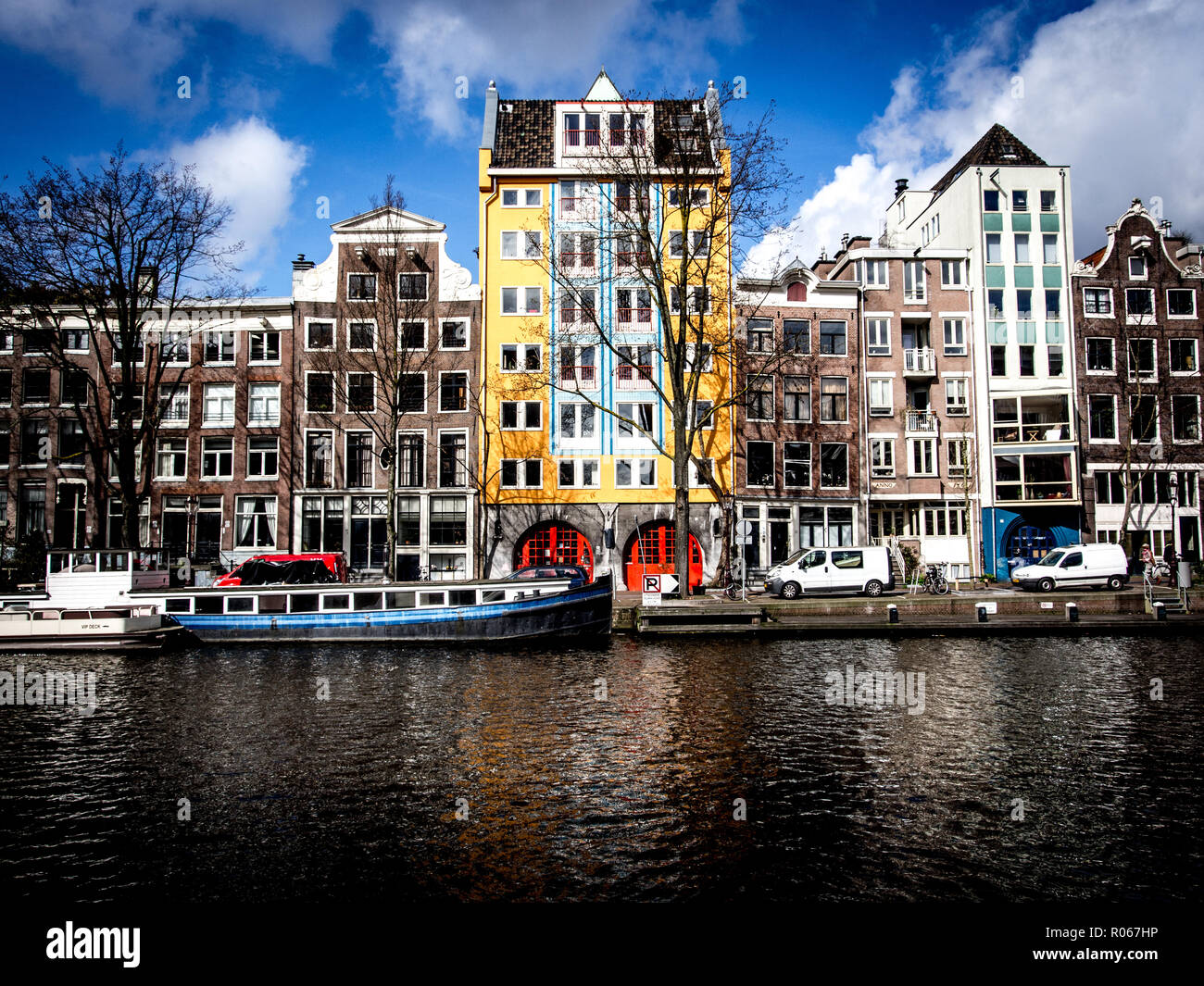 A view of the houseboats and flats from across the river/canal Stock Photo
