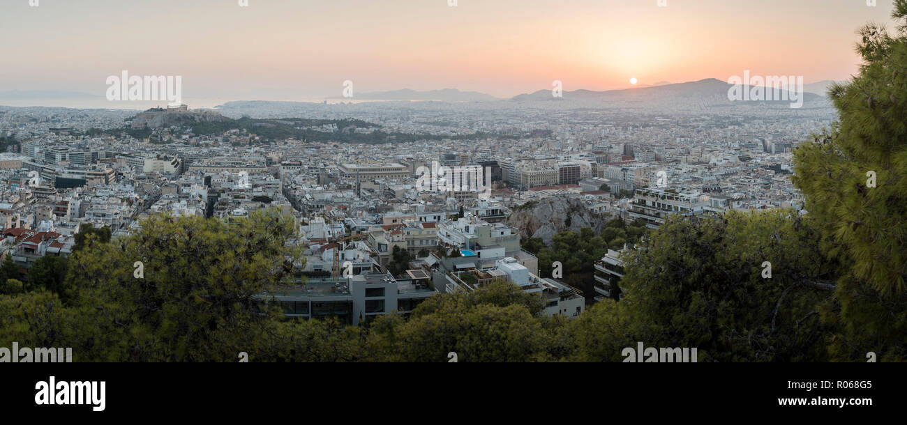 View over Athens and The Acropolis at sunset from Likavitos Hill, Athens, Attica Region, Greece, Europe Stock Photo