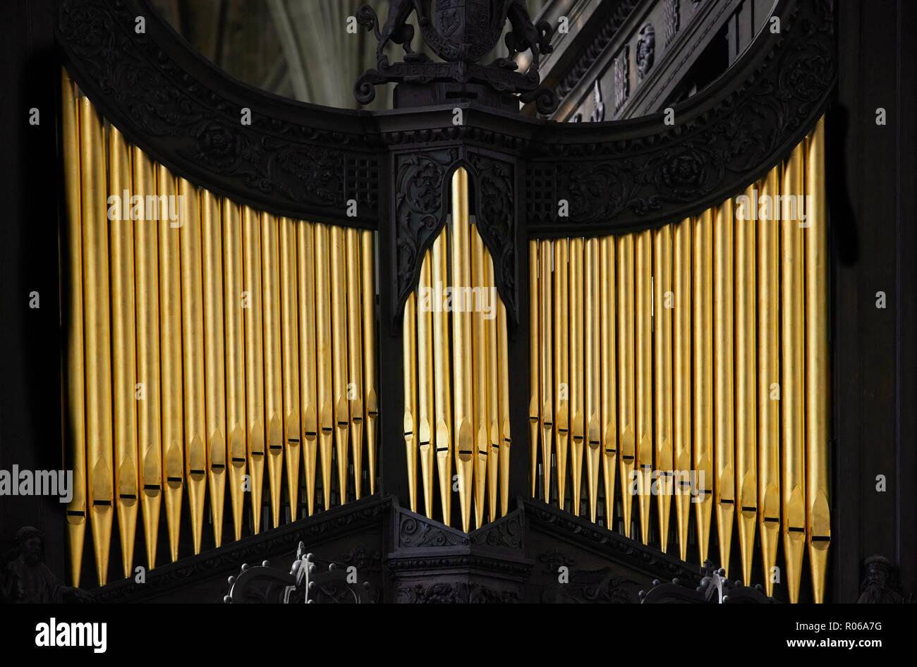 Organ pipes on the wooden rood screen in the tudor medieval chapel of King's college, university