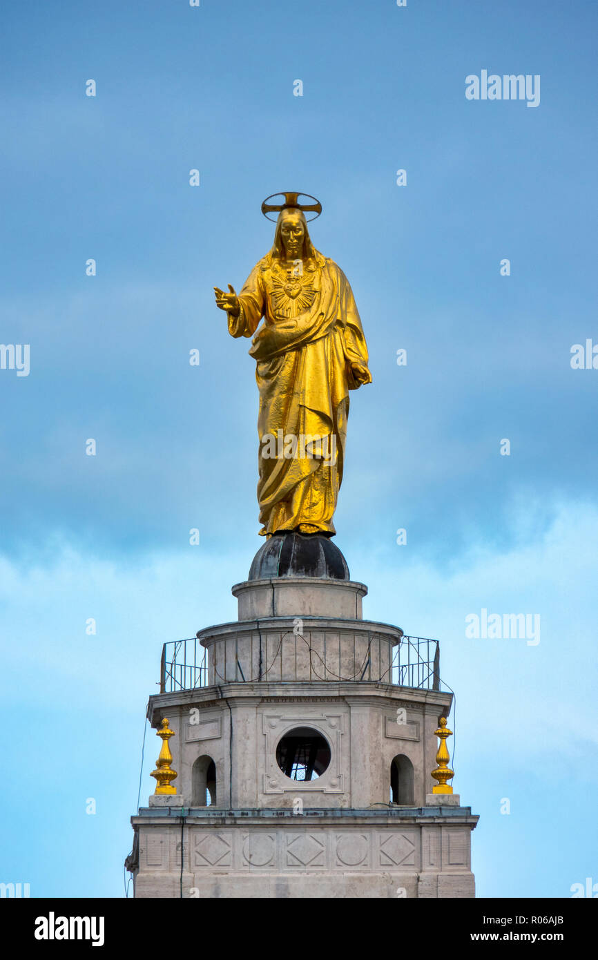 Statue of Christ the Redeemer atop the belltower of the Sacro Cuore di Gesú al Castro Pretorio, Rome Italy Stock Photo