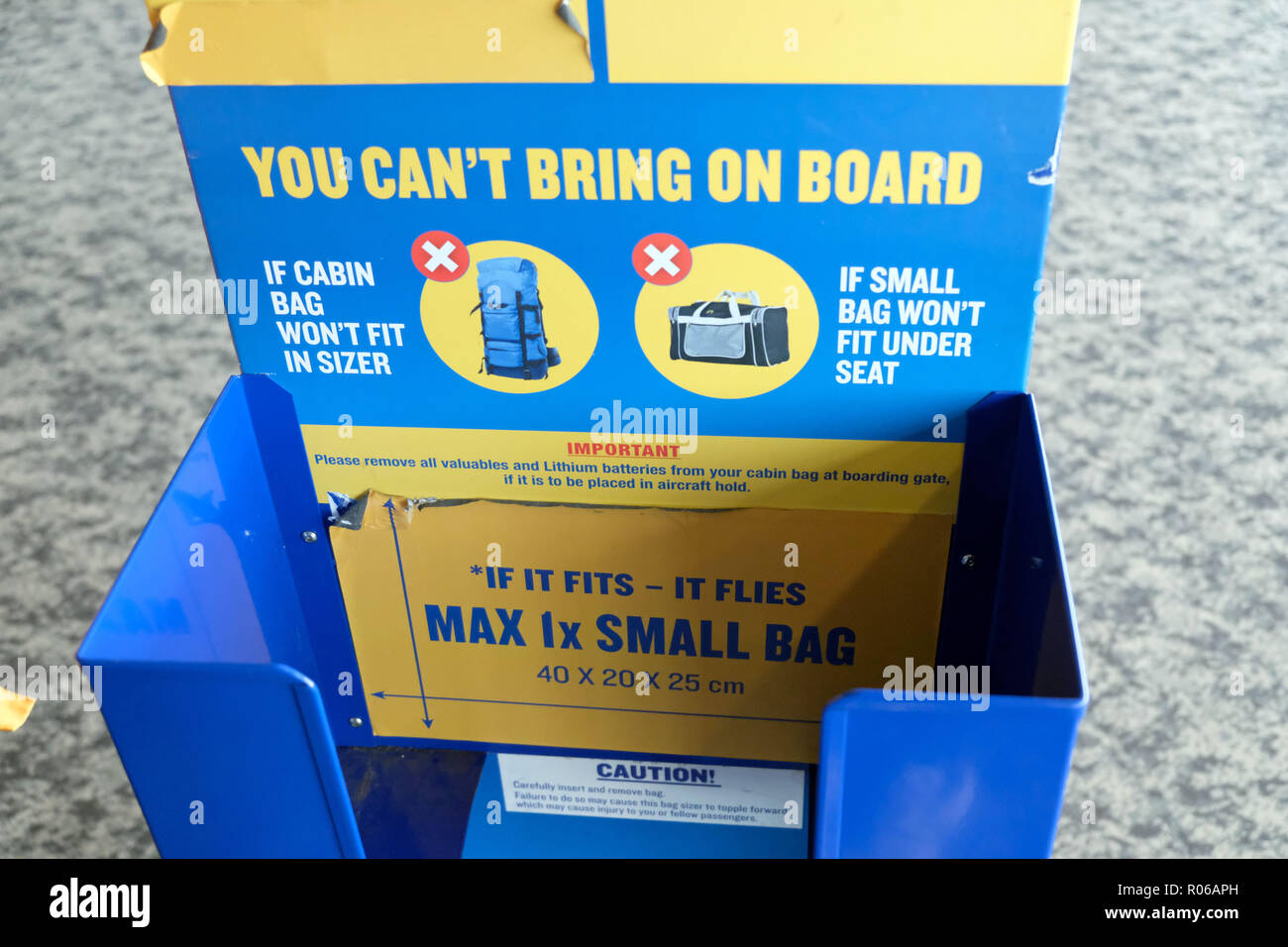 Pic shows: New tiny bag size allowed on Ryanair planes for free.  Checking sizer at all the gates to stop passengers see here at Stansted Airport.   P Stock Photo