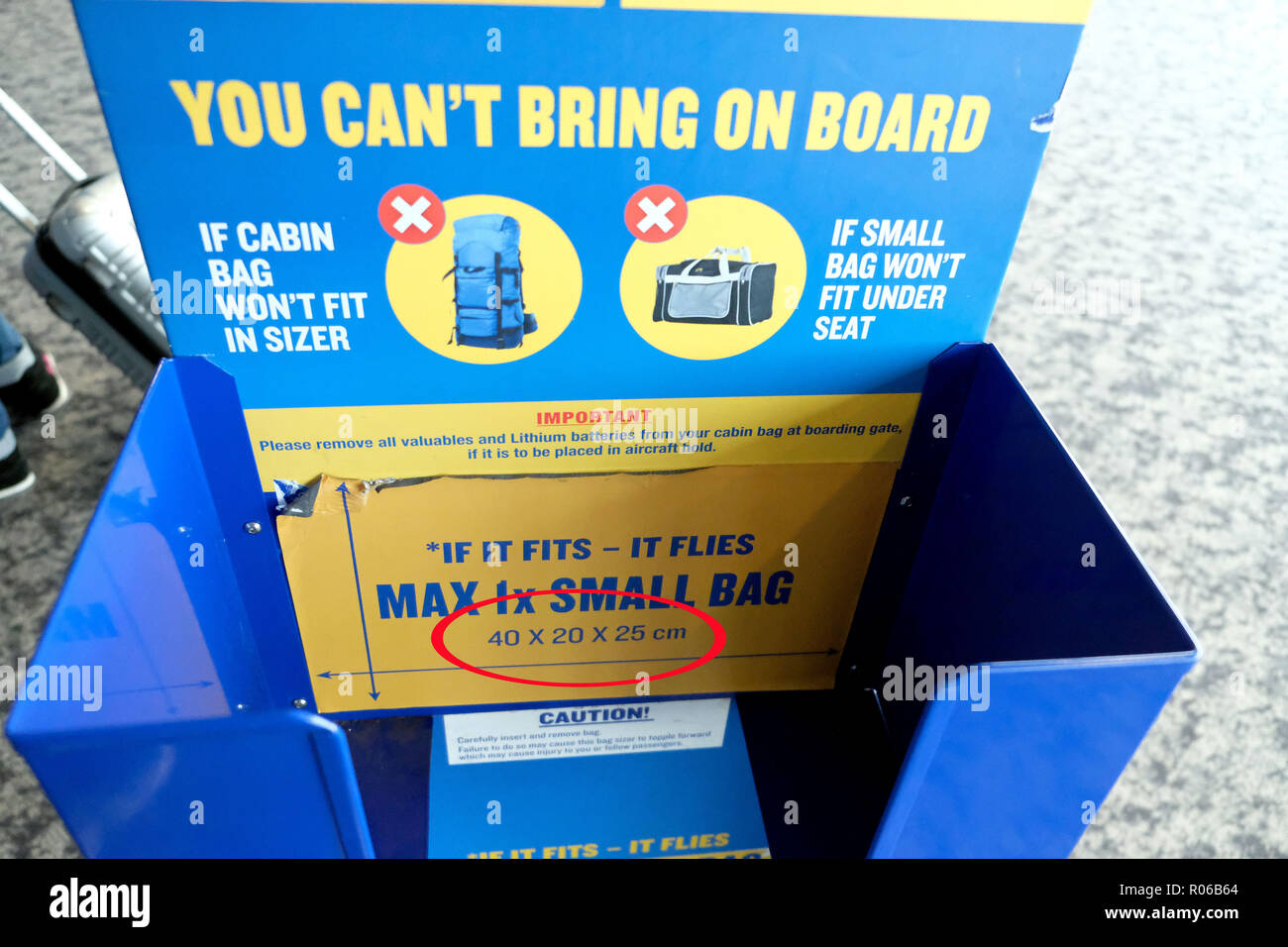 Pic shows: New tiny bag size allowed on Ryanair planes for free. Checking  sizer at all the gates to stop passengers see here at Stansted Airport. P  Stock Photo - Alamy