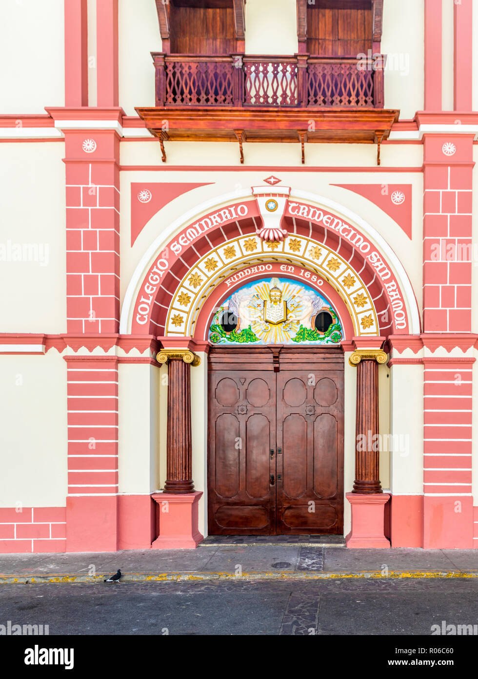 The colourful Renaissance influenced facade of the College of San Ramon by Central Park, Leon, Nicaragua, Central America Stock Photo