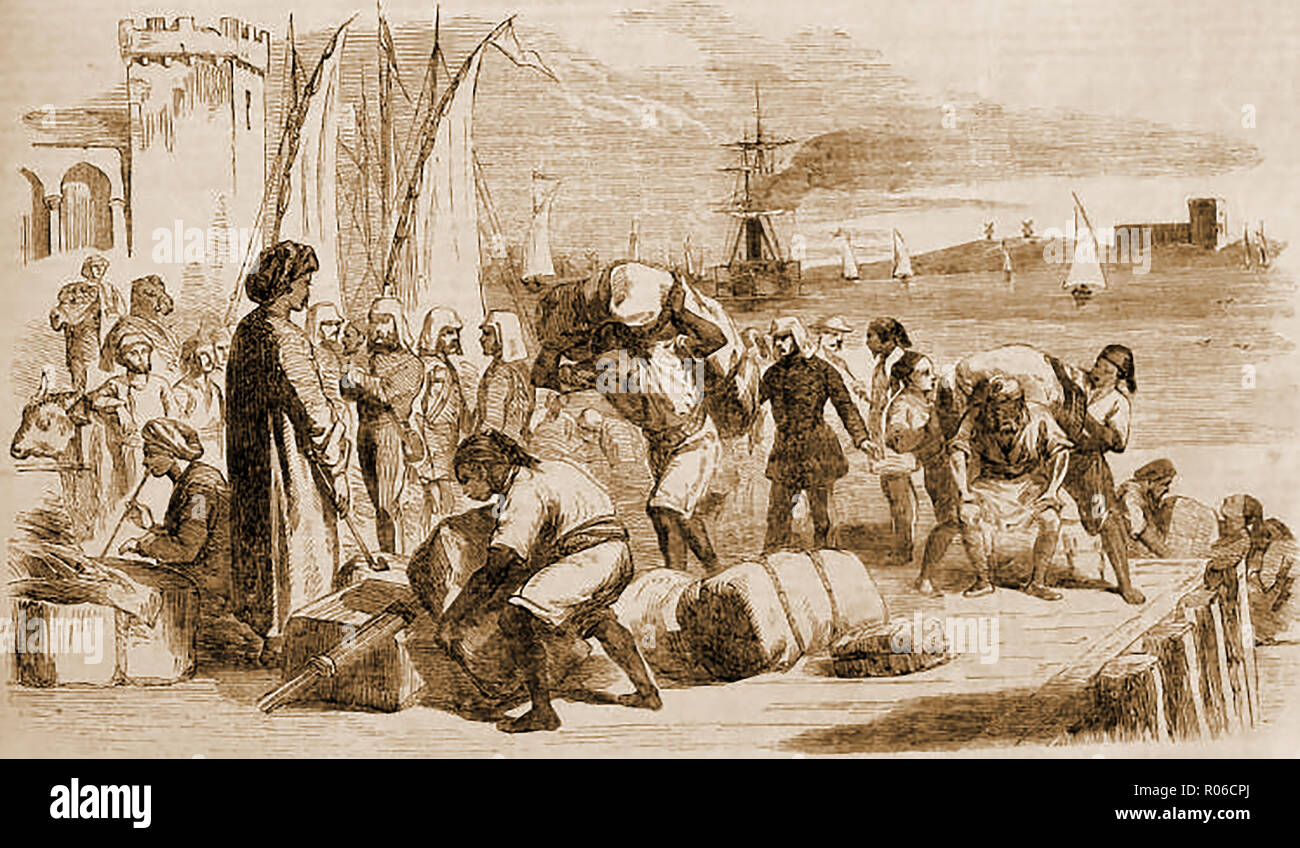 1859 -  How people dressed in Egypt- workers,merchants and military on the landing pier at Alexandria Stock Photo