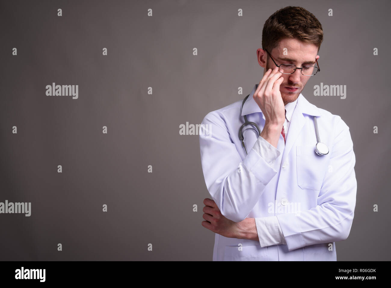 Tired doctor wearing medical hi-res stock photography and images - Alamy