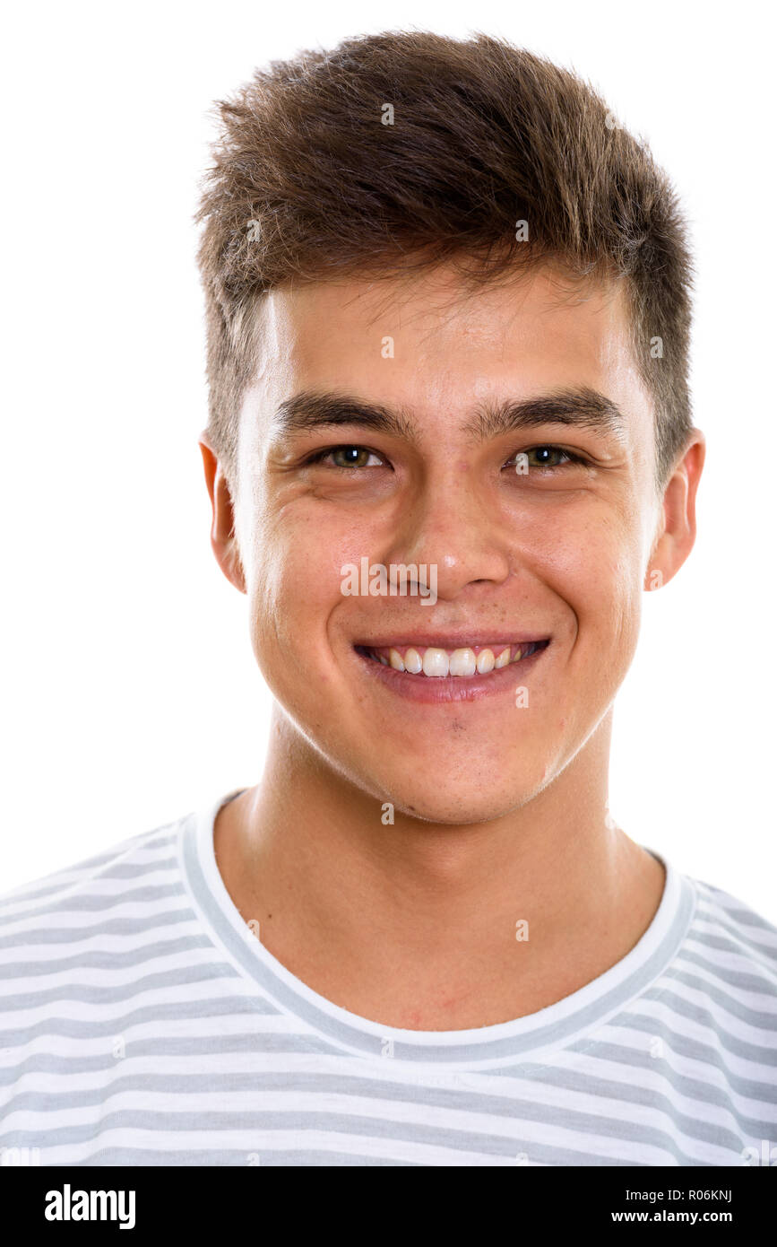 Face of young happy man smiling while looking at camera Stock Photo - Alamy