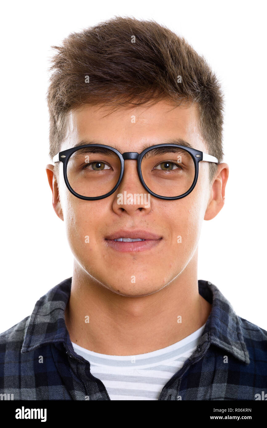 Face of young handsome man wearing eyeglasses and checkered shir Stock Photo