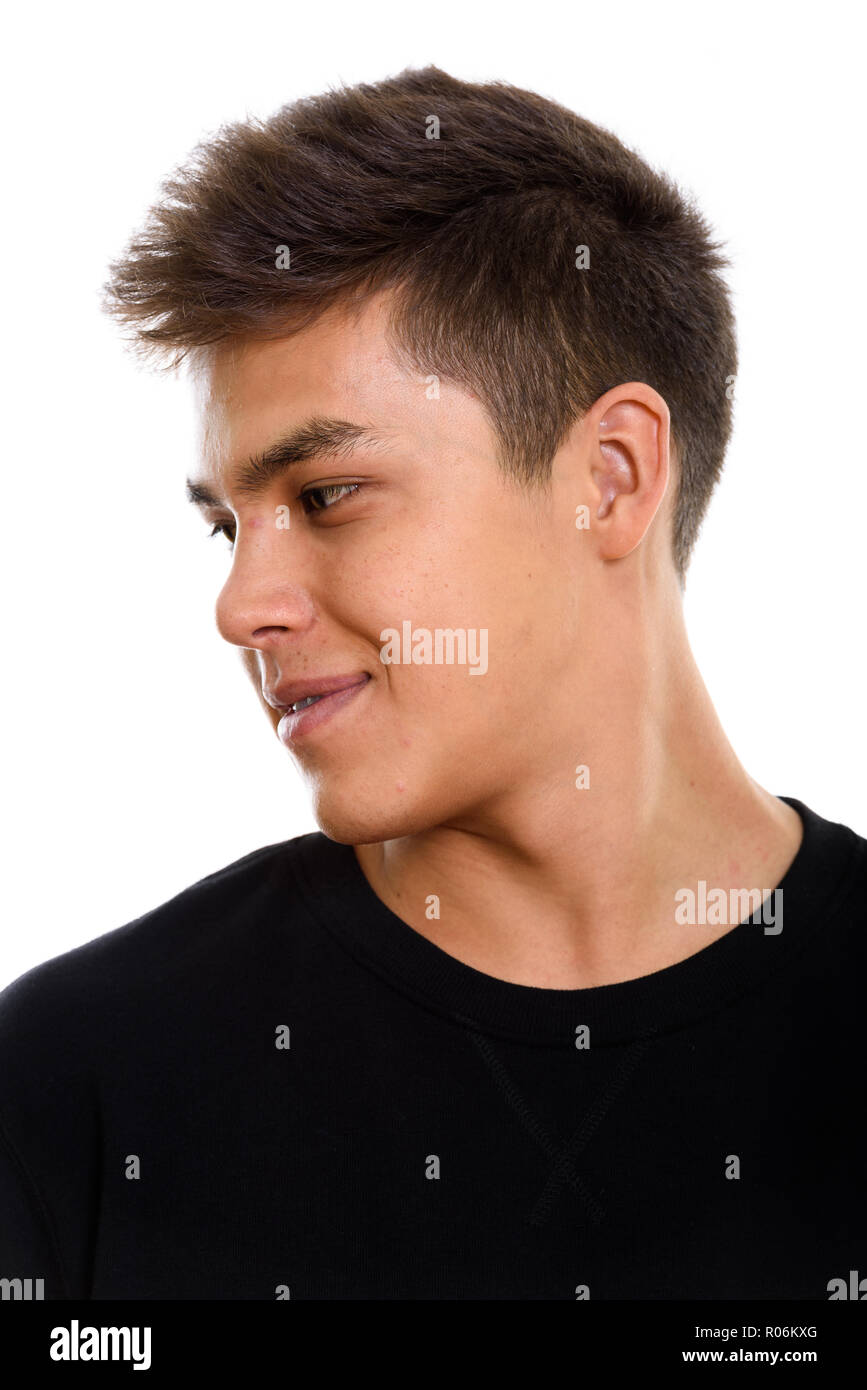 Face of young handsome man looking away Stock Photo