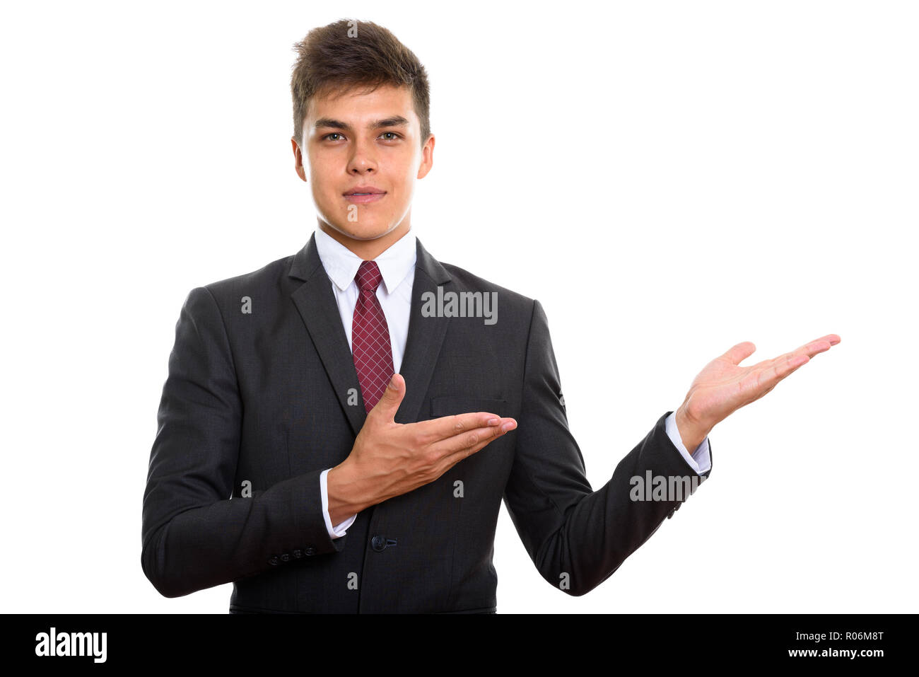 Businessman showing something and looking at camera Stock Photo