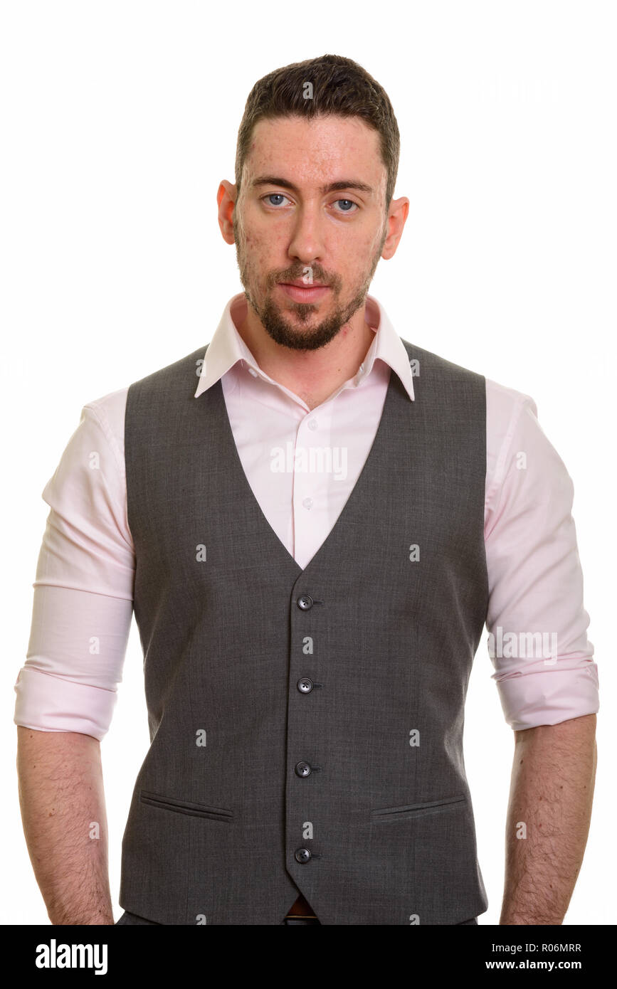Young formal Caucasian man wearing vest looking at camera Stock Photo
