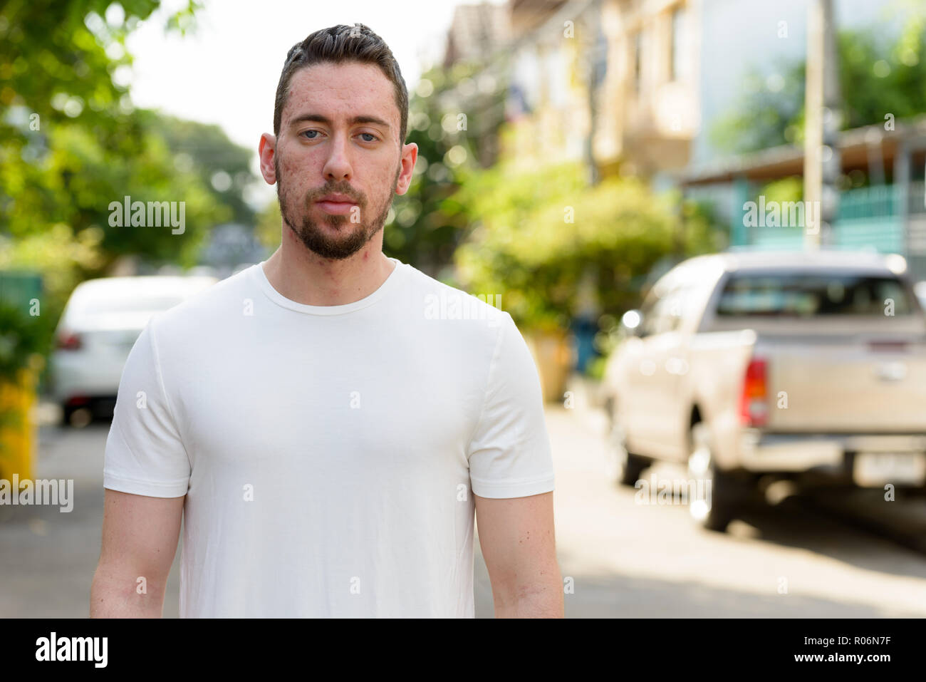Portrait of young handsome Caucasian man outdoors Stock Photo