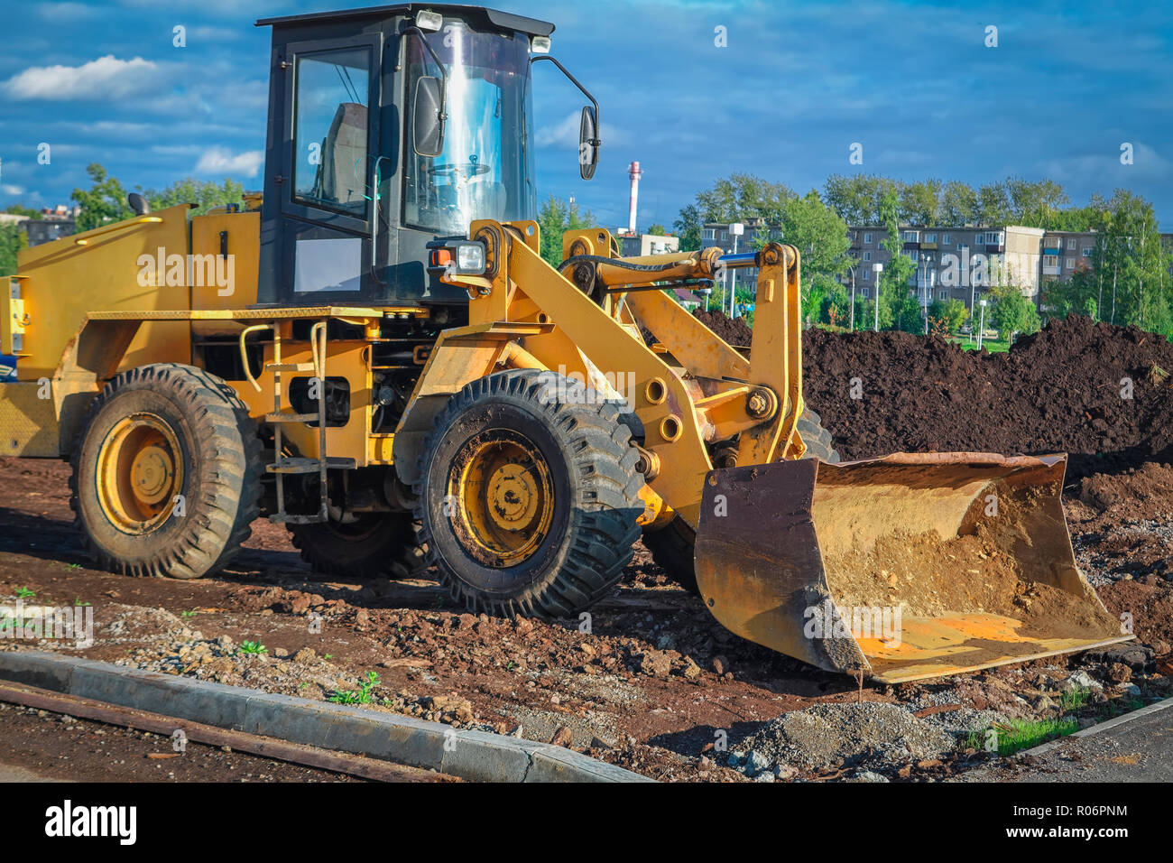 The yellow Tractor at a construction site Stock Photo Alamy