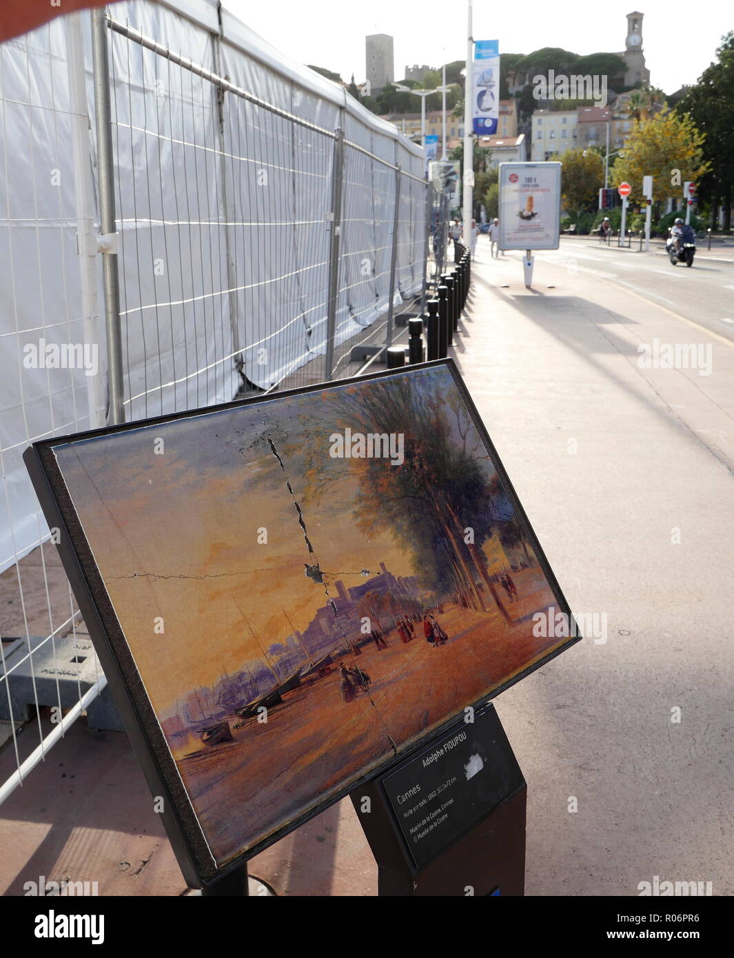 AJAXNETPHOTO. 2018. CANNES, FRANCE. - BORDS DE LA MEDITERRANEE - INFORMATION PANEL FOR OIL PAINTING OF CANNES CROISETTE WITH THE SUQUET DISTANT BY ADOLPHE FIOUPOU 1862; ORIGINAL PAINTING HOUSED IN THE MUSEE DE LA CASTRE.  PHOTO:JONATHAN EASTLAND/AJAX REF:GX8 182509 575 Stock Photo