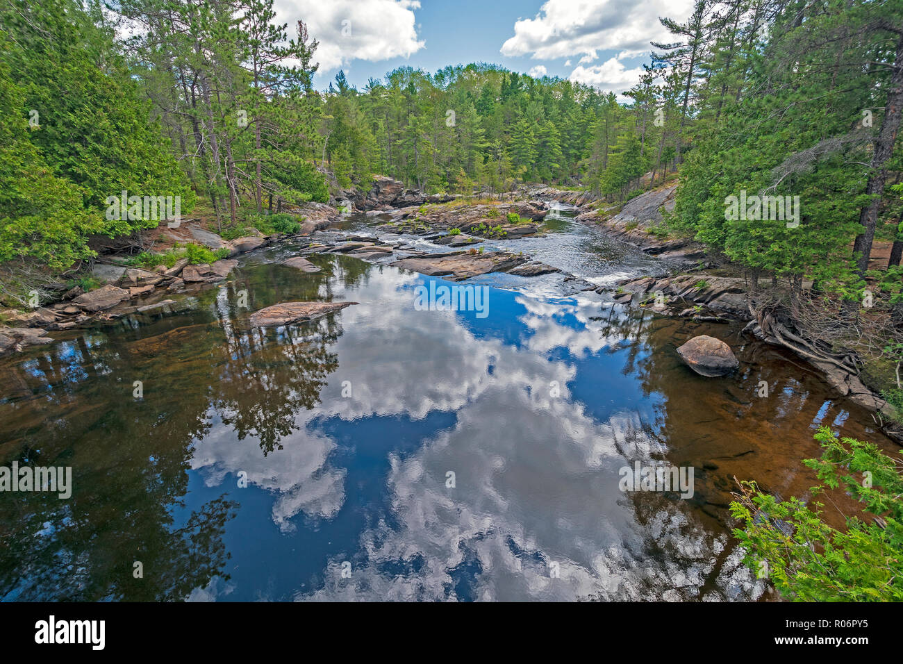 Reflections on a Flatwater Stream in Chutes Provincial Park near Massey, Ontario Stock Photo