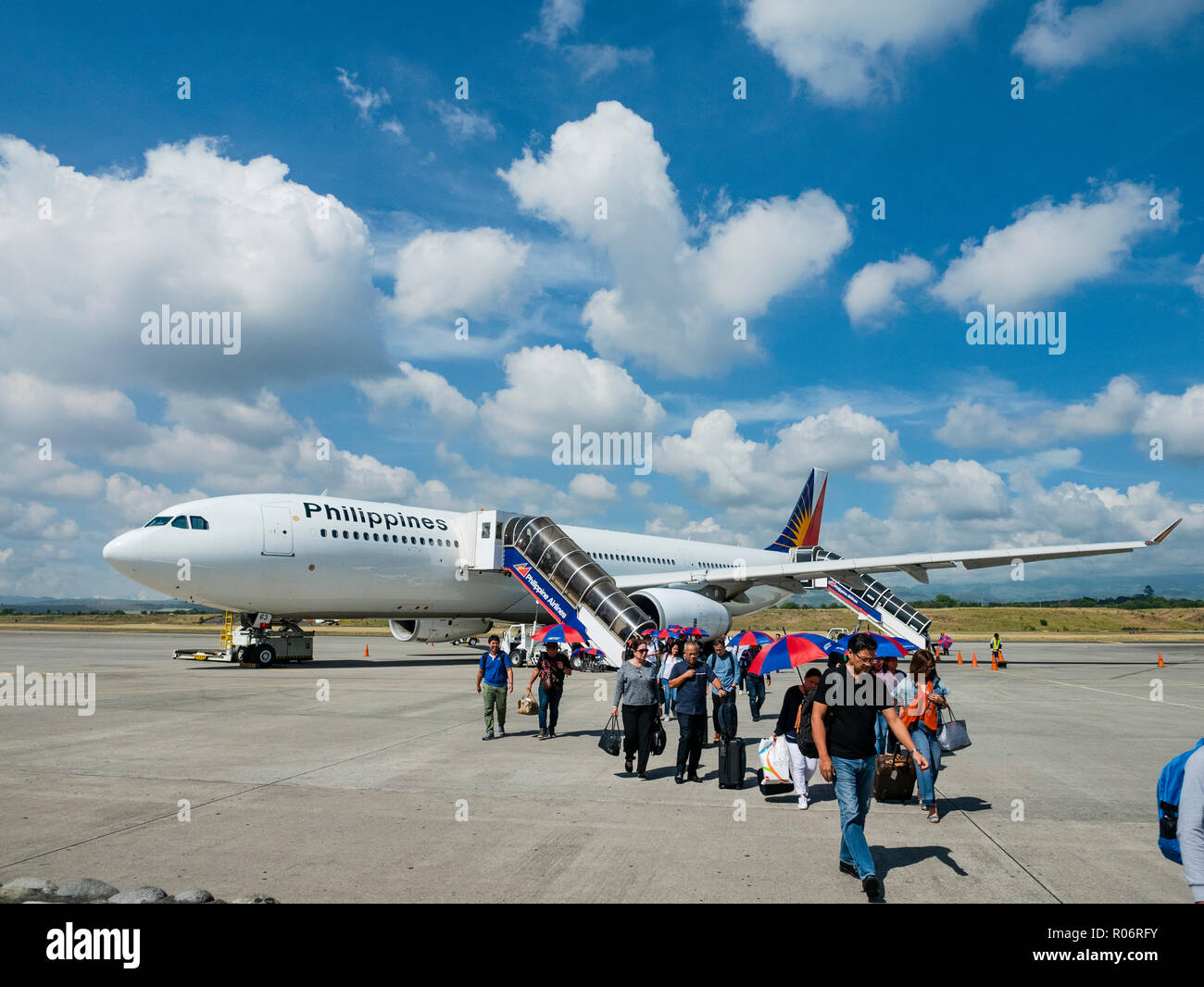 Passengers arriving with a Philippine Airlines Airbus A330 at General Santos International Airport at General Santos City in South Cotabato Province o Stock Photo