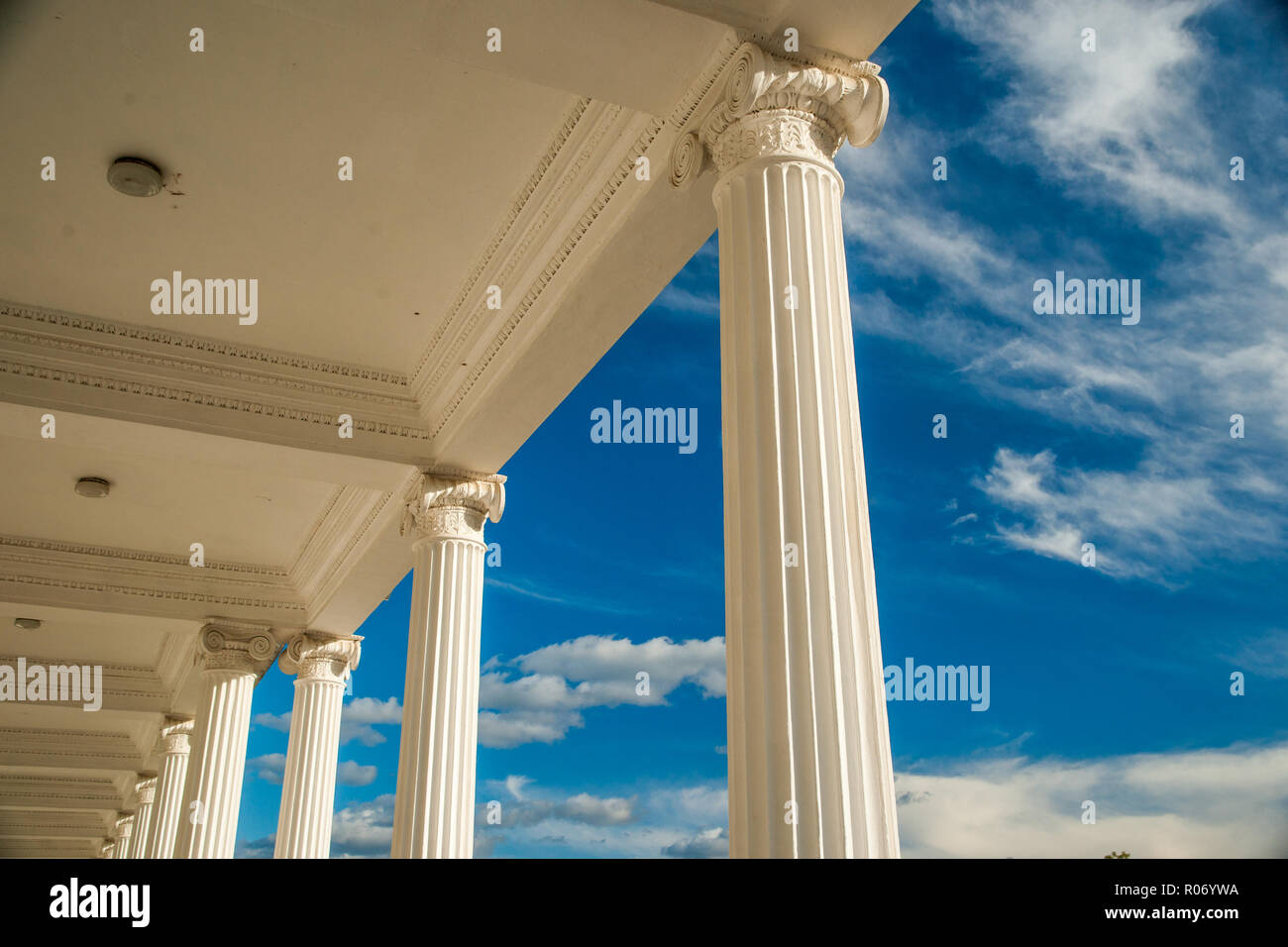 Columns on blue sky background Stock Photo - Alamy