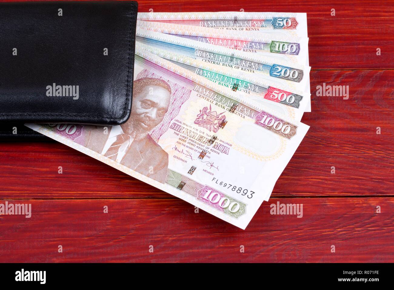 Kenyan money in the black wallet Stock Photo
