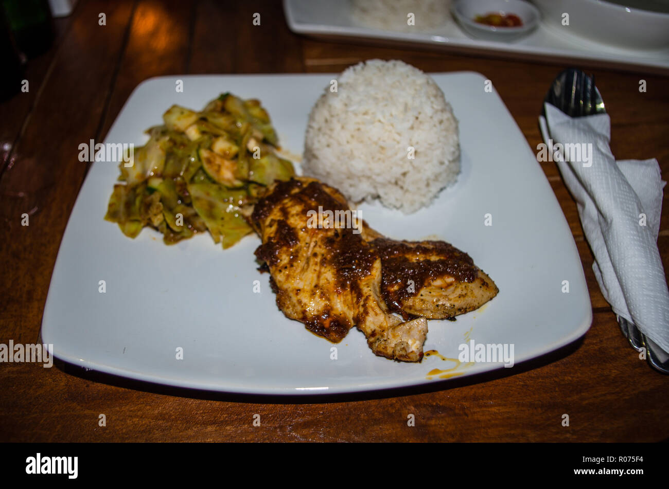 AYAM TALIWANG - Typical Indonesian dish in Lombok (grilled chicken) Stock Photo