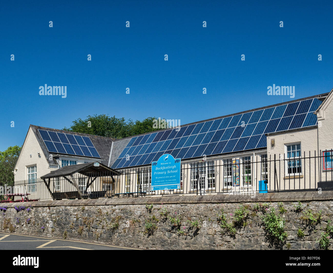 28 May 2018: Buckfastleigh,Devon, UK - Buckfastleigh Primary School, with its roof covered in solar panels. Stock Photo