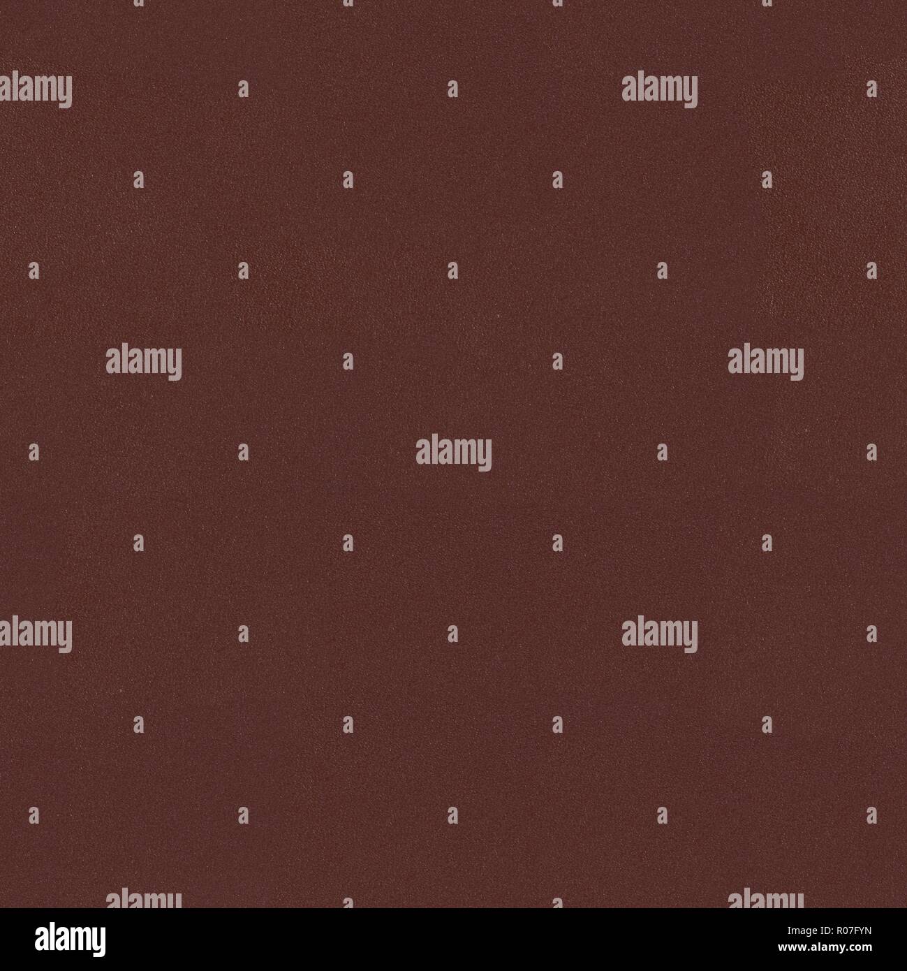Dark red leather texture. Seamless square background, tile ready. Stock Photo
