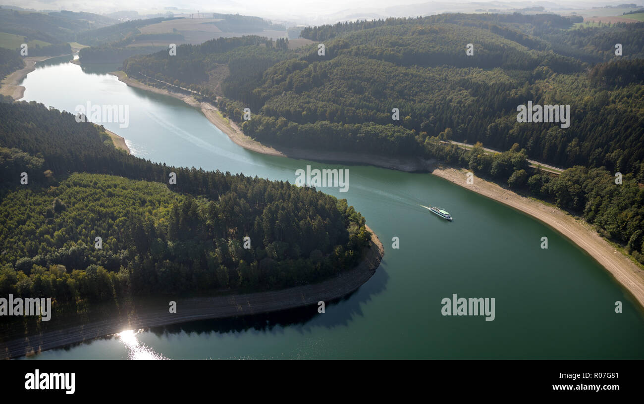 Aerial view, tour boat on the reservoir, lake, Hennesee in the nature park Sauerland-Rothaargebirge dams the water of the hen, reservoir, Hennesee at  Stock Photo