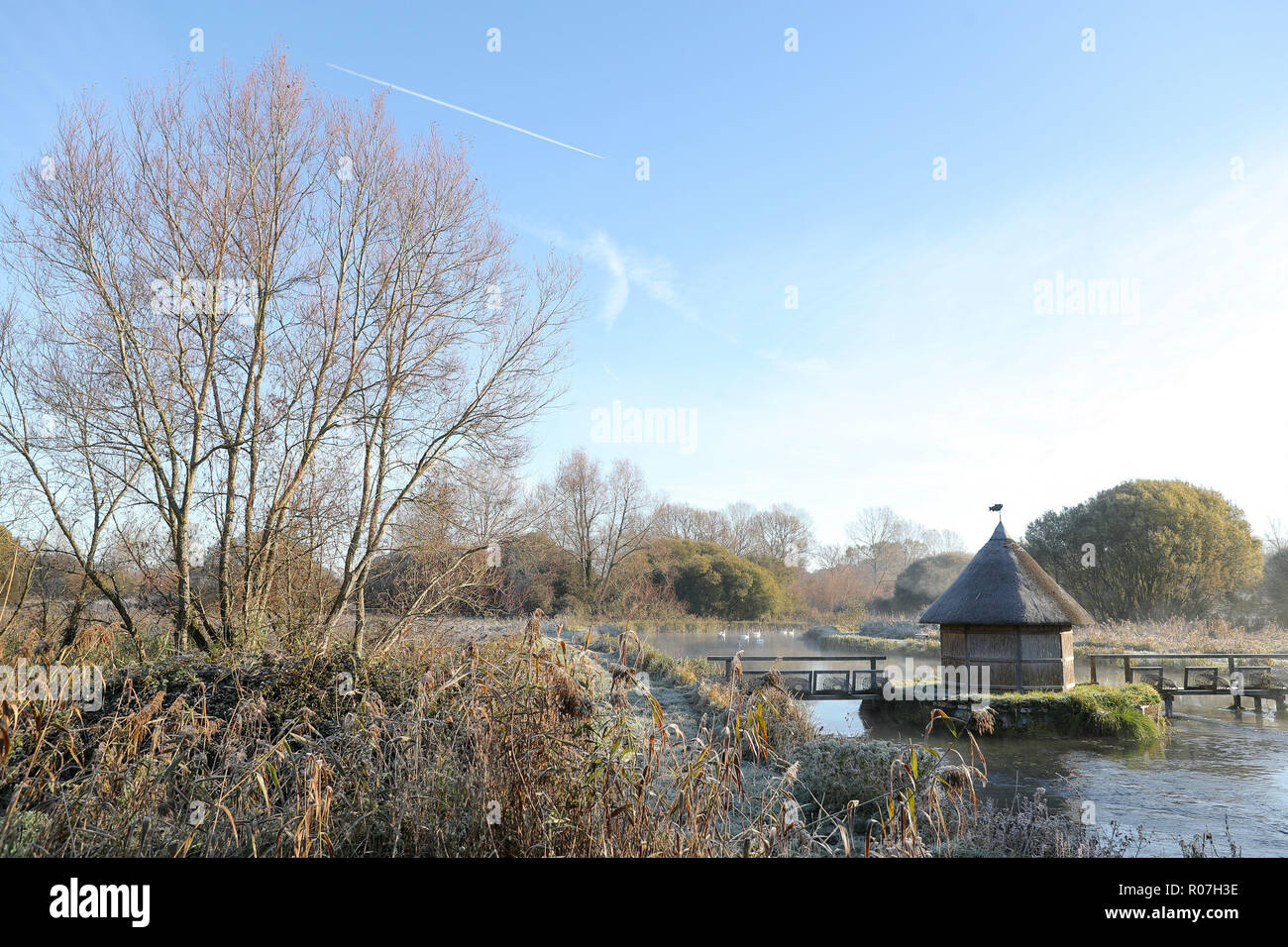 A light frost covers the banks of the river Test near to Stockbridge in Hampshire. Stock Photo