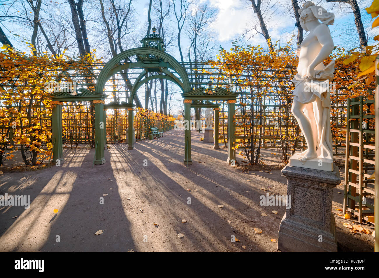 Decorative gates in 'Summer garden' park in Saint Petersburg, Russia. Bright autumn landscape at sunset Stock Photo