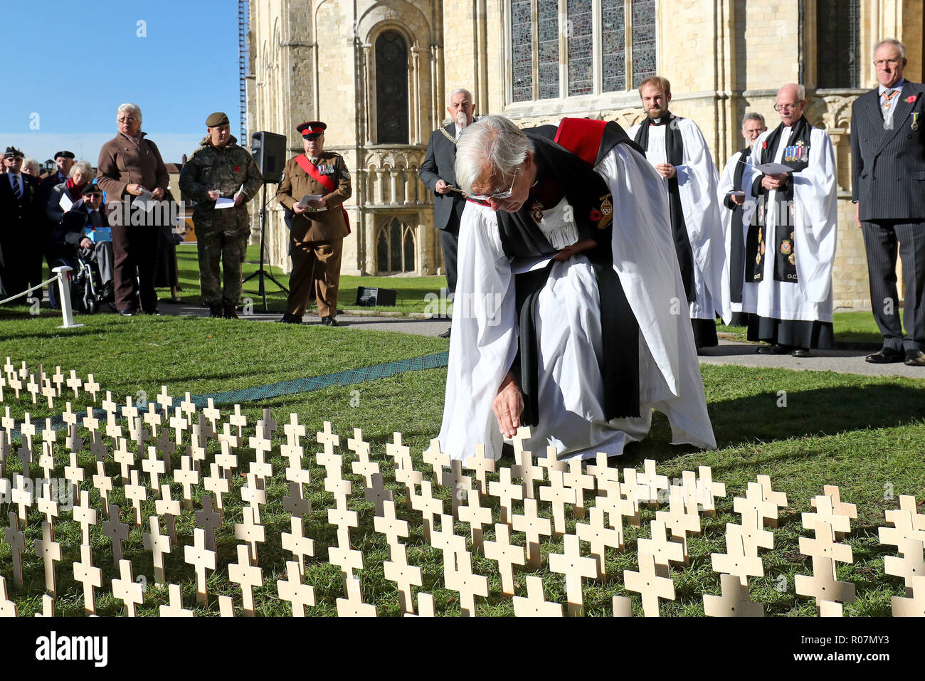 The Very Revd Robert Willis, Dean of Canterbury Cathedral, places a