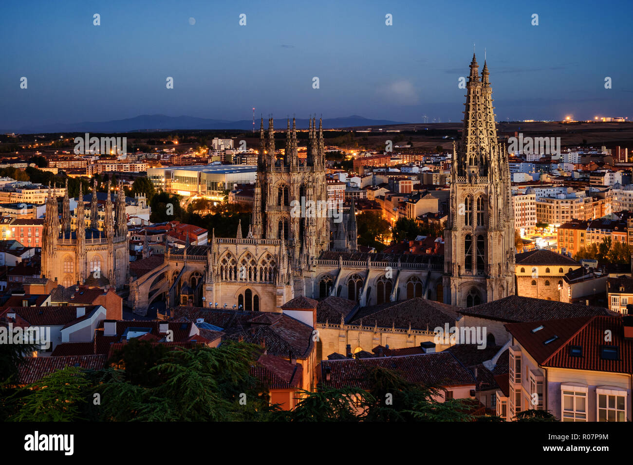 Time-blended sunset/night view over the city and cathedral of Burgos in Spain Stock Photo