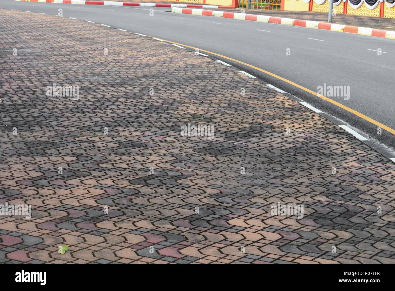 Stone block walk path in the roadside: Select focus with shallow depth ...